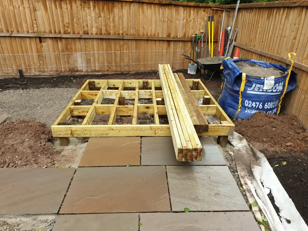 Timber deck frame construction for pergola seating area in a courtyard garden