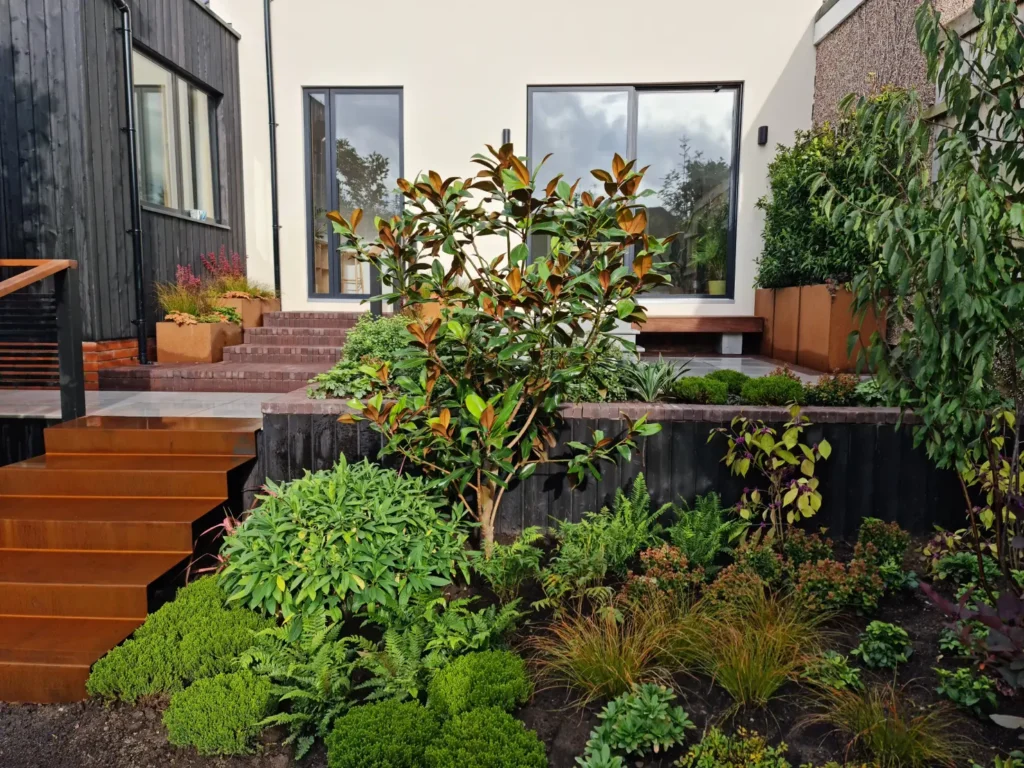 Nordic Soul Allerton courtyard garden with corten steps, planting and raised terraces