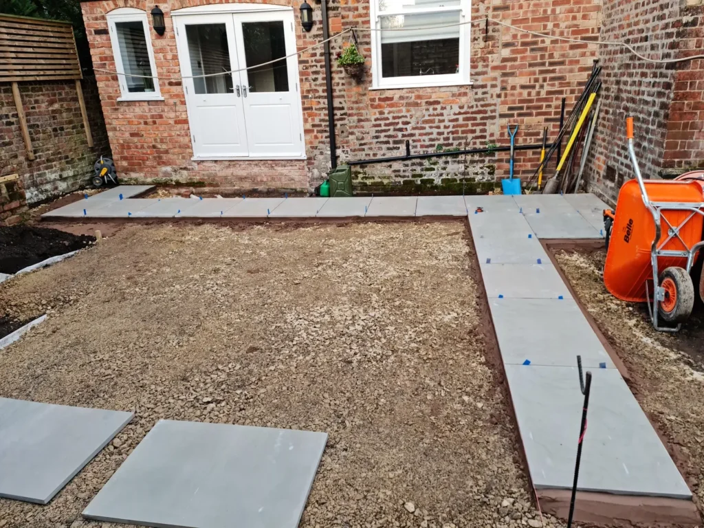 Sandstone paving installation during Victorian garden remodel in Altrincham
