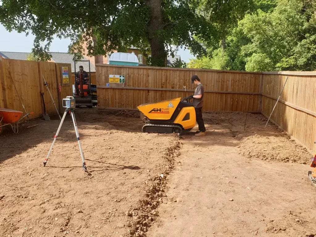 Landigo team setting levels and preparing foundations for a Malpas garden makeover