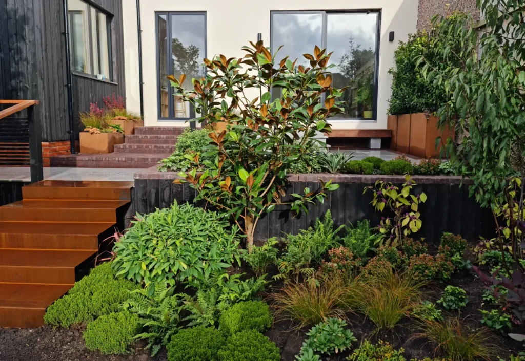 Nordic Soul Allerton courtyard garden with corten steel steps, raised terraces and lush planting